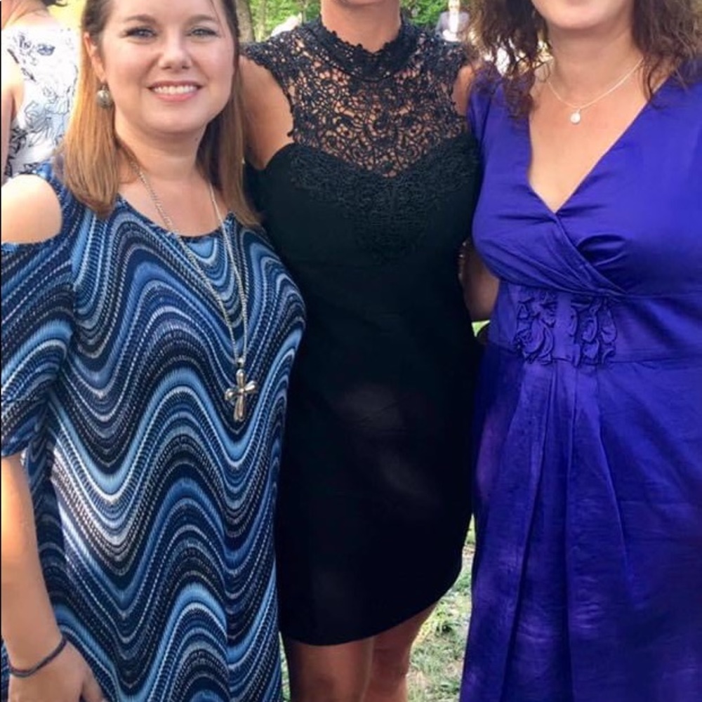 Black medium bodycon bandage cocktail dress.  Lace neck.